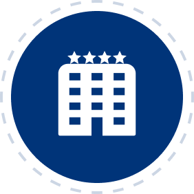 Icon depicting a hotel building with four stars on top, set against a blue circular background with a dashed border.